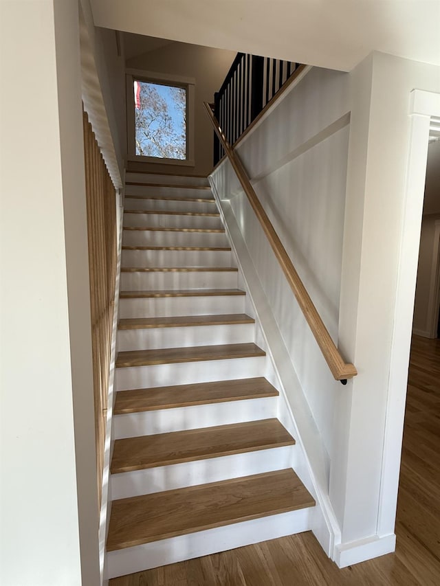 stairs with wood finished floors