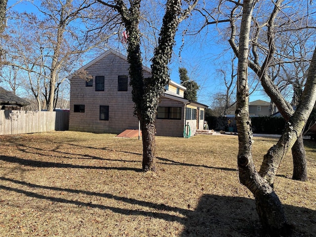 view of side of home with fence