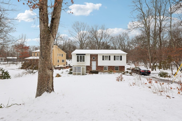 split foyer home with brick siding