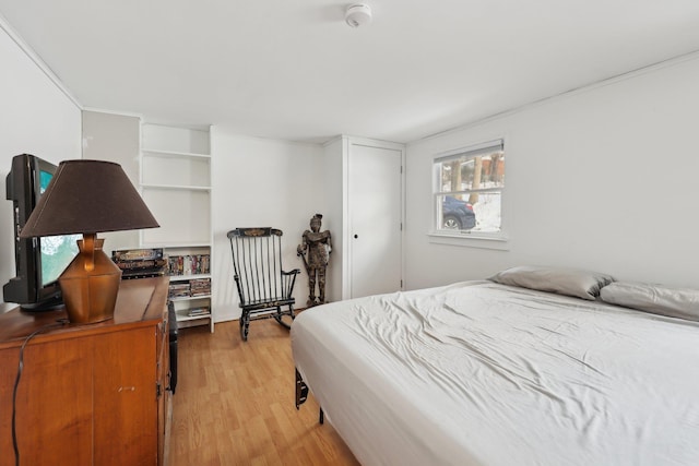 bedroom with light wood-type flooring