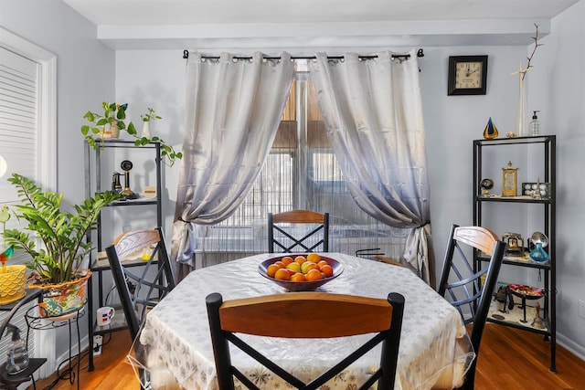 dining area with hardwood / wood-style floors