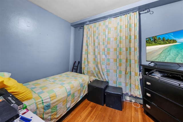 bedroom with light hardwood / wood-style flooring