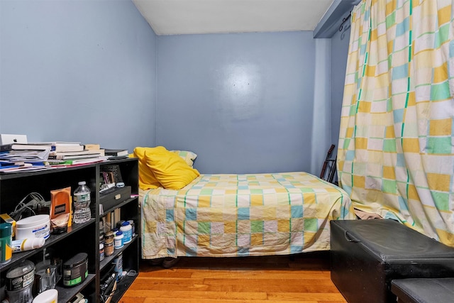 bedroom featuring hardwood / wood-style floors