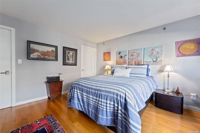 bedroom featuring wood-type flooring