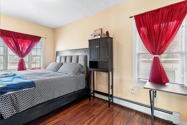 bedroom featuring dark wood-type flooring and a baseboard radiator