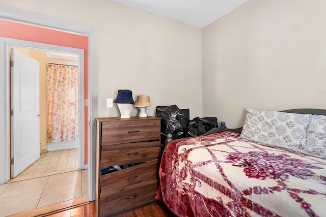 bedroom featuring light tile patterned floors