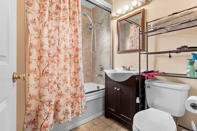 full bathroom featuring shower / bath combination with curtain, tile patterned floors, toilet, and vanity