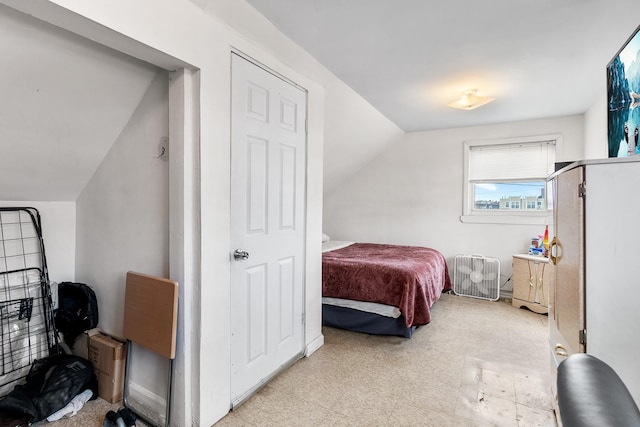 bedroom featuring lofted ceiling