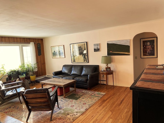 living room with hardwood / wood-style flooring and a baseboard radiator