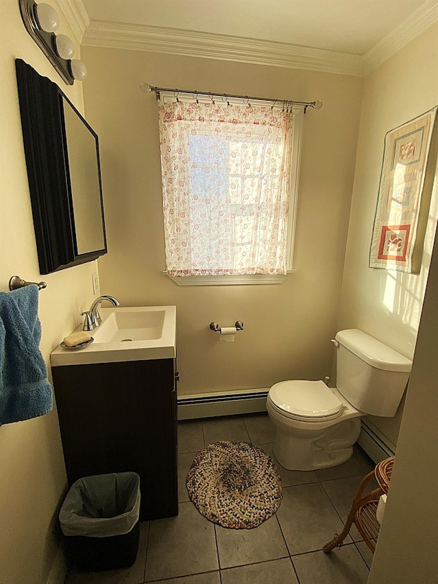 bathroom with toilet, a baseboard heating unit, tile patterned floors, ornamental molding, and vanity