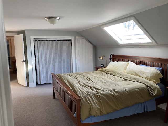 carpeted bedroom with lofted ceiling