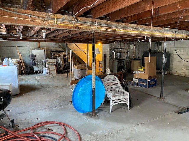 basement with gas water heater and washer / clothes dryer