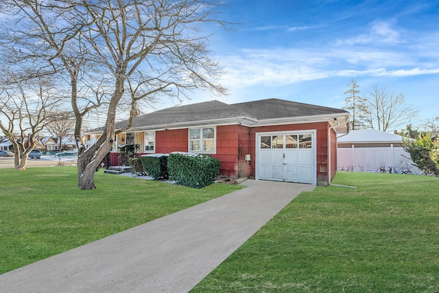 ranch-style home featuring a front yard and a garage