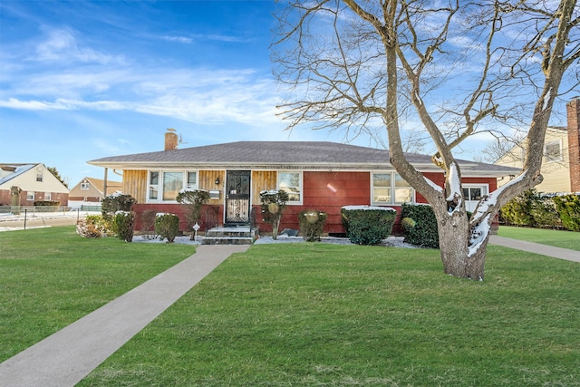 single story home featuring a front yard