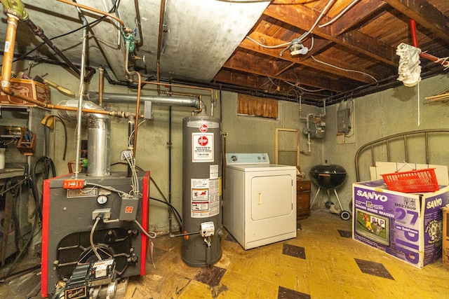 utility room featuring gas water heater and washer / clothes dryer