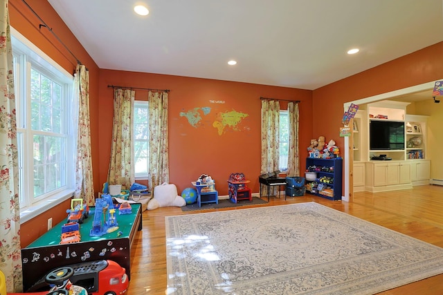 playroom featuring hardwood / wood-style floors