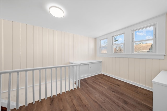 unfurnished room featuring dark wood-type flooring