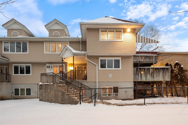 view of front of home featuring a wall mounted air conditioner