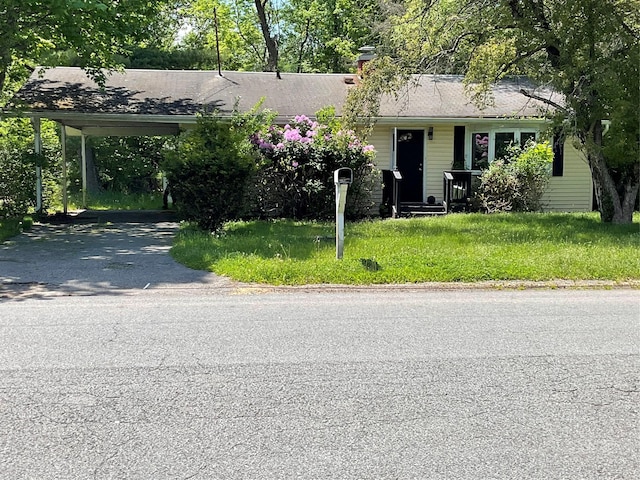 view of front of home featuring a carport