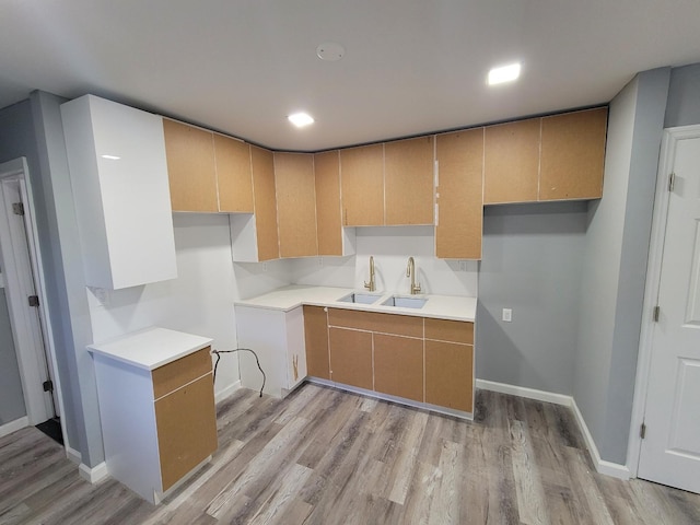 kitchen featuring sink and light hardwood / wood-style flooring