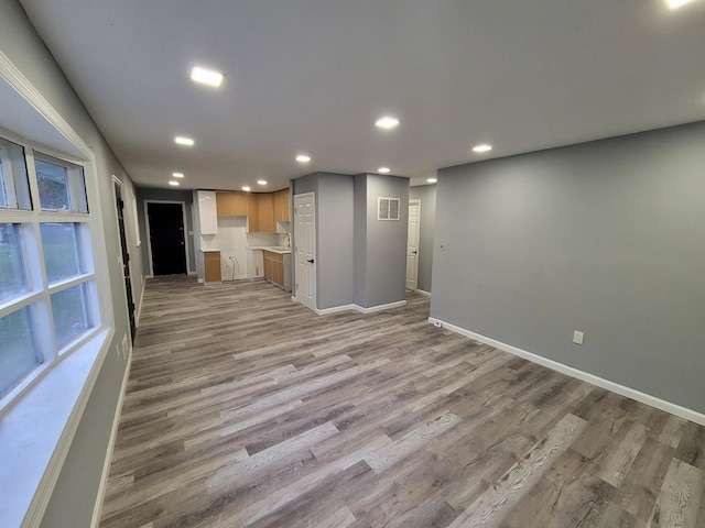 unfurnished living room featuring light hardwood / wood-style floors