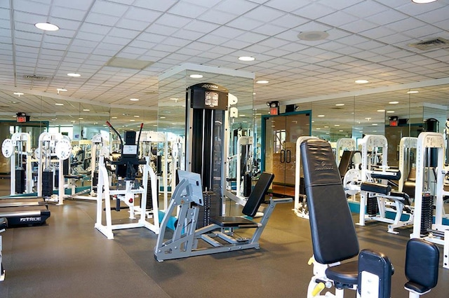 exercise room featuring a drop ceiling