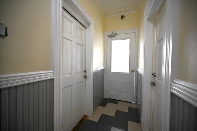 doorway to outside with crown molding