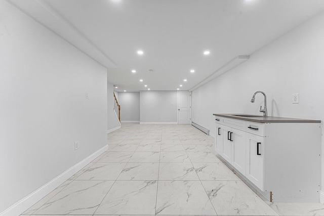 interior space featuring sink and baseboard heating