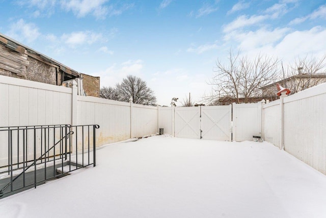 view of yard covered in snow