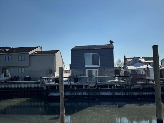 back of house with a water view