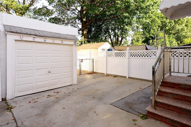 exterior space with a garage and an outdoor structure