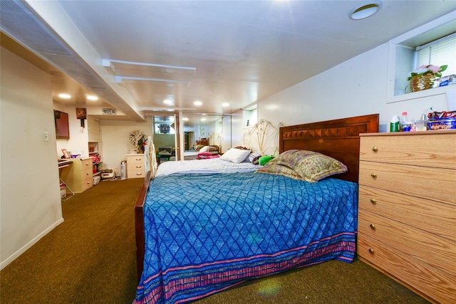 bedroom featuring dark carpet