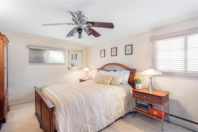 bedroom featuring multiple windows, light colored carpet, ceiling fan, and baseboard heating