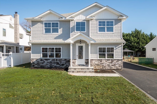 craftsman-style home with a front yard