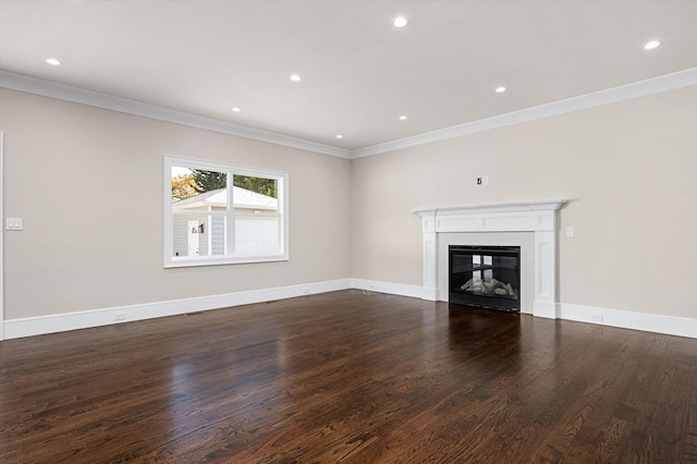 unfurnished living room featuring ornamental molding and dark hardwood / wood-style floors