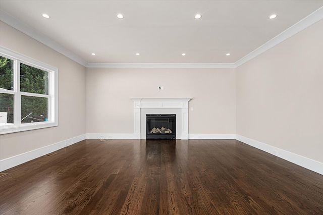 unfurnished living room featuring dark hardwood / wood-style flooring and ornamental molding