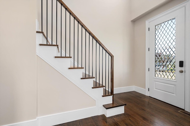 foyer with dark hardwood / wood-style flooring