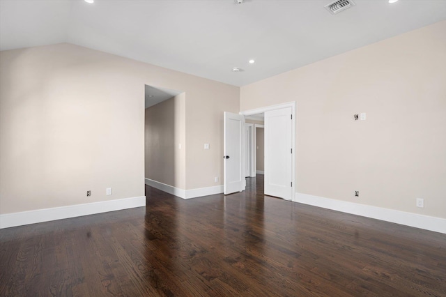 unfurnished room featuring dark hardwood / wood-style flooring and lofted ceiling