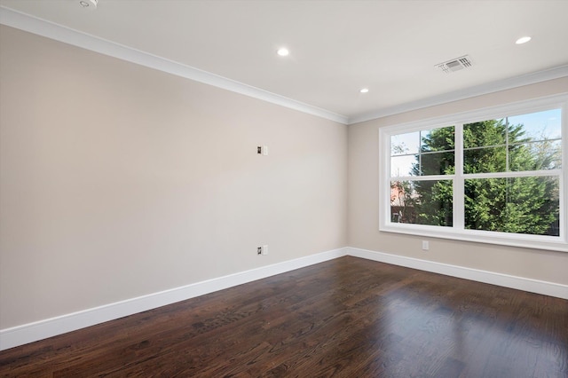 unfurnished room featuring dark hardwood / wood-style floors and crown molding