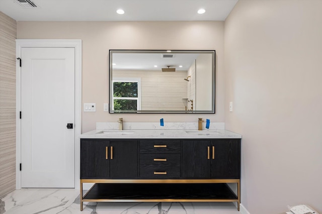 bathroom with walk in shower and vanity