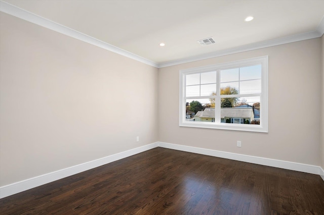 empty room with crown molding and dark wood-type flooring