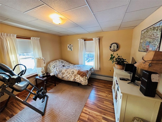 bedroom with light wood-type flooring and multiple windows