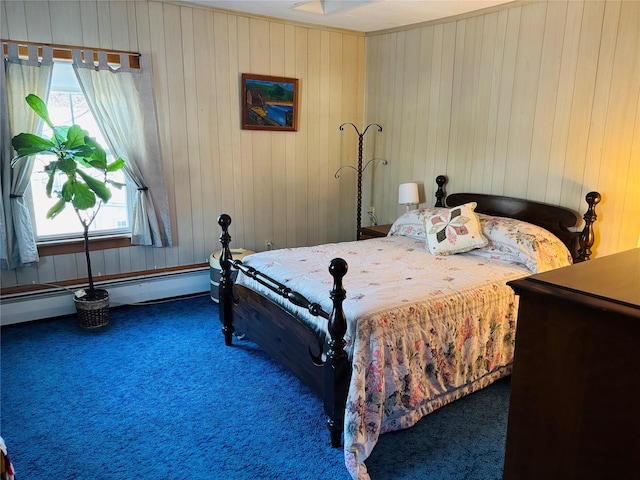 bedroom with dark carpet, multiple windows, wooden walls, and a baseboard radiator