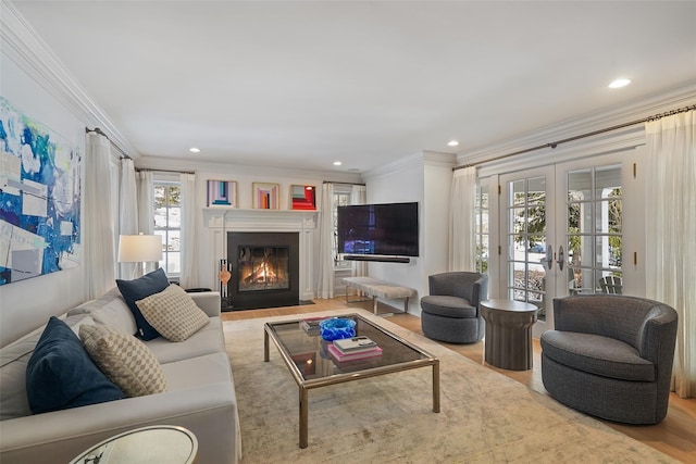 living room with crown molding, french doors, and hardwood / wood-style flooring