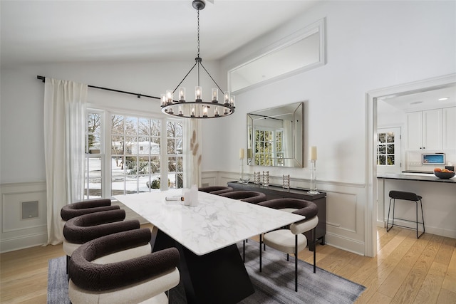 dining area with a wealth of natural light and light hardwood / wood-style floors