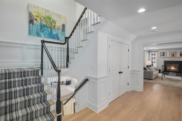 stairs featuring hardwood / wood-style flooring