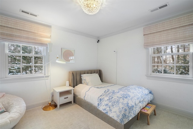 carpeted bedroom featuring ornamental molding