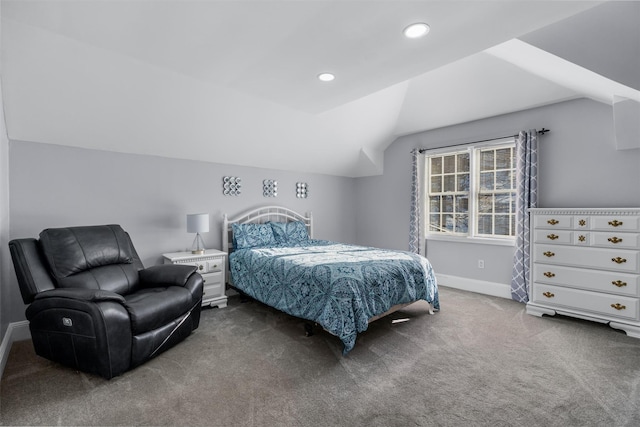 bedroom with lofted ceiling and carpet floors