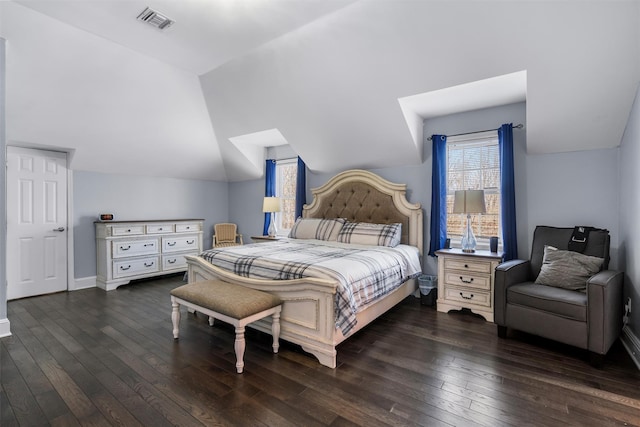 bedroom featuring lofted ceiling and dark hardwood / wood-style floors