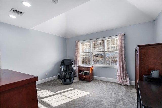 sitting room featuring vaulted ceiling and light colored carpet